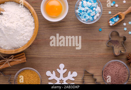 ingredients and kitchen tools for dessert baking on wooden background Stock Photo