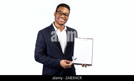 Black guy in suit showing blank clipboard Stock Photo