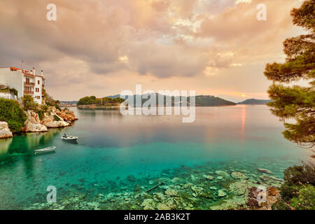 The sunrise at the old port in the Chora of Skiathos island, Greece Stock Photo