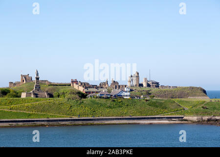 Tynemputh Priory and Castle at Tynemouth in England. The Collingwood Memorial looks out over the River Tyne. Stock Photo