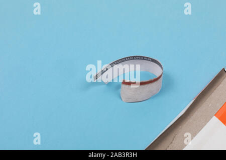 Opened envelope and a sealing part of an envelope post saying customs inspection, please open here. Upper part, paper seal laying on the floor in a ro Stock Photo