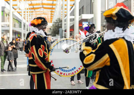 Eindhoven, The Netherlands, November 23rd 2019. Happy Pieten wearing their colorful costumes in a marching band playing Sinterklaas music. Dutch festi Stock Photo