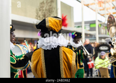 Eindhoven, The Netherlands, November 23rd 2019. Pieten wearing their colorful costumes in a marching band playing Sinterklaas music. Dutch traditional Stock Photo
