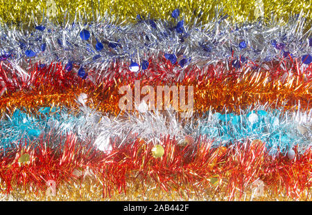 Multicolored Christmas tinsel in a line Stock Photo