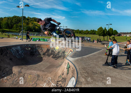 Pro, Professional BMX riders compete in a annual competition at the Stoke on Trent skatepark, riding around the park, bowl and walls performing tricks Stock Photo