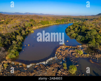 A sunrise over the Mazowe river seen from a drone. Stock Photo