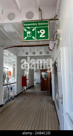 A cruise ship sign designating where the assembly station is in case of ...