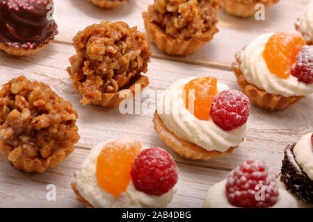 Sweet cookies, closeup of various kinds of cakes on event or wedding reception Stock Photo