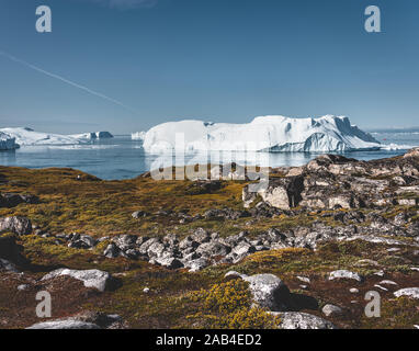 View towards Icefjord in Ilulissat. Easy hiking route to the famous Kangia glacier near Ilulissat in Greenland. The Ilulissat Icefjord seen from the Stock Photo