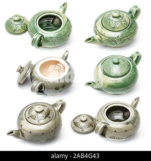 Set of handmade ceramic teapots on white background Stock Photo