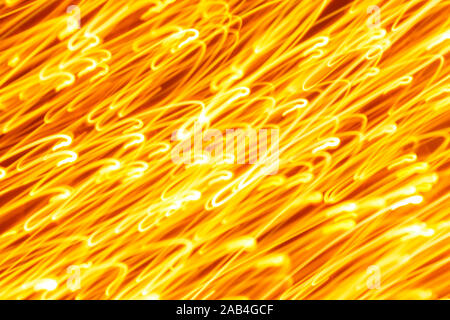 Futuristic blurred lights holiday monochrome background in yellow. Horizontal, soft focus Stock Photo