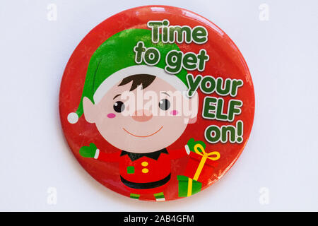 Time to get your elf on red round badge, pin badge, isolated on white background - for wearing at Christmas Stock Photo