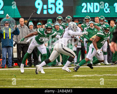 East Rutherford, New Jersey, USA. 24th Nov, 2019. Oakland Raiders running back Josh Jacobs (28) runs by New York Jets free safety Marcus Maye (20) during a NFL game between the Oakland Raiders and the New York Jets at MetLife Stadium in East Rutherford, New Jersey. Duncan Williams/CSM/Alamy Live News Stock Photo