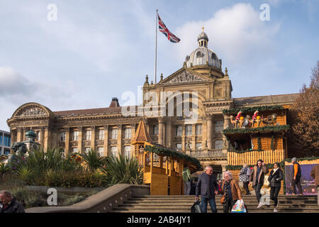 Wooden cabins selling food and drink at the Birmingham Frankfurt German Christmas Market in Victoria Square, Birmingham, UK Stock Photo