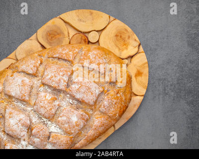 Bread on wood. Brown grain bread on wooden board. Bakery and grocery food concept Stock Photo