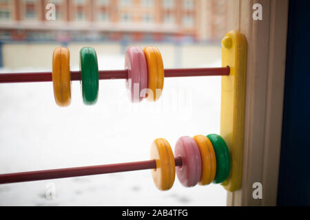 Children's abacus on the children's outdoor Playground. Close up. Stock Photo
