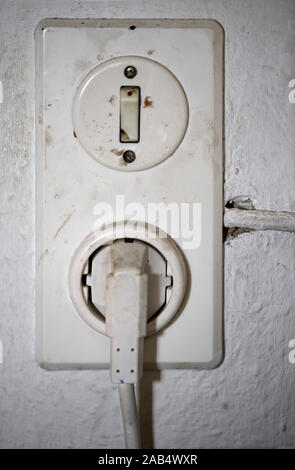 Old electrical socket and switch Stock Photo