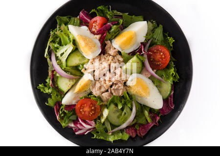 Salad with tuna, egg and vegetables isolated on white background. Top view. Stock Photo