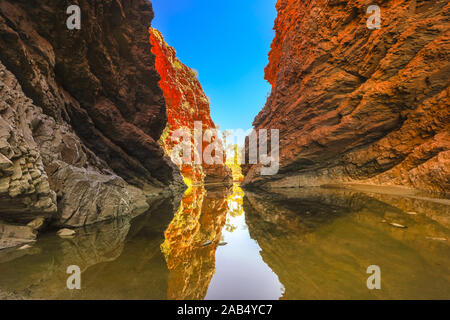 Simpsons Gap reflected in permanent waterhole in West MacDonnell National Park, Northern Territory near Alice Springs on Larapinta Trail in Central Stock Photo