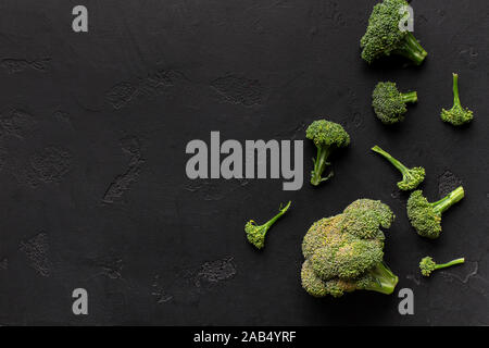 Heads of broccoli isolated on black background Stock Photo