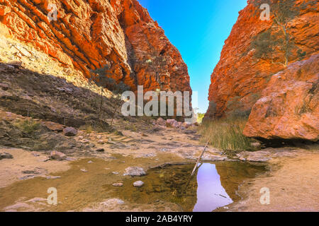 Simpsons Gap reflected in permanent waterhole in West MacDonnell National Park, Northern Territory near Alice Springs on Larapinta Trail in Central Stock Photo