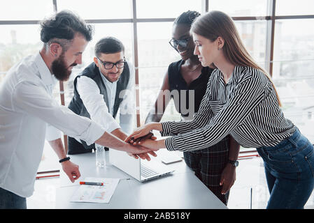 Young business people are discussing new creative ideas together during a meeting in the office. Stock Photo