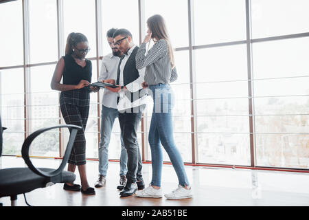Young business people are discussing new creative ideas together during a meeting in the office Stock Photo