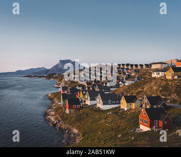 Nuuk capital of Greenland with Beautiful small colorful houses in myggedalen during Sunset Sunrise Midnight Sun. Sermitsiaq Mountain in Background Stock Photo