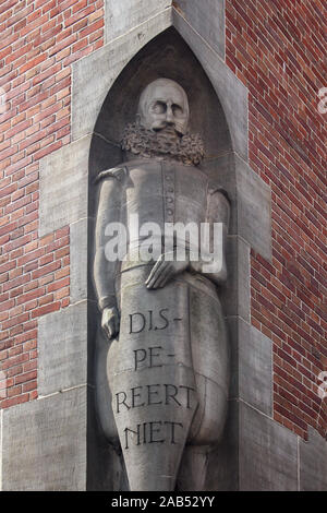 Close up view of a historical statue at 'Beurs van Berlage', vast former stock exchange building with a square tower used for events, concerts & exhib Stock Photo