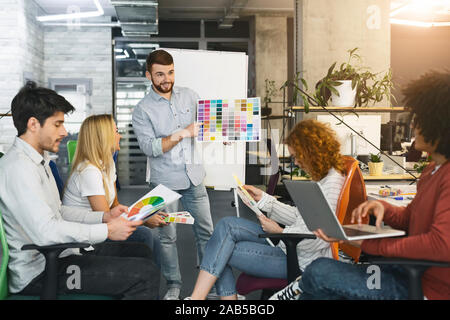 Professional creative team choosing color design for new project Stock Photo