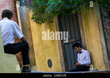 SINTRA, PORTUGAL - OCTOBER  31, 2017. Street photography with men relaxing on street , Sintra , Portugal. Stock Photo