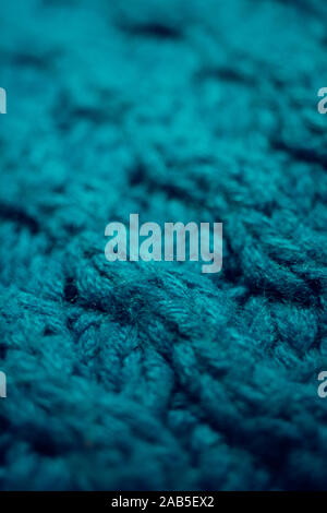 Knitted texture, blue thread pattern, cozy winter background. Stock Photo