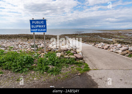 Sign: Public Slipway, Keep Clear - seen in Parton Beach, Cumbria, England, UK Stock Photo