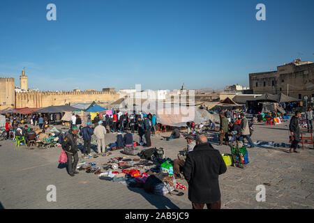 Fez, Morocco. November 9, 2019.  the stands of clothing vendors in the large Place Boujloud Stock Photo