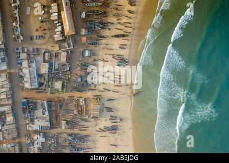 Aerial view of fishing village, pirogues fishing boats in Kayar, Senegal.  Photo made by drone from above. Africa Landscapes. Stock Photo