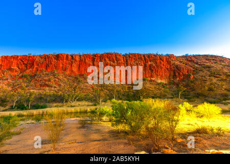 Blue hour at Glen Helen Gorge in Tjoritja - West MacDonnell Ranges National Park, Northern Territory, Australia Outback. Copy space. Stock Photo