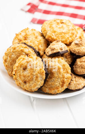 Coconut cookies with chocolate on plate. Stock Photo