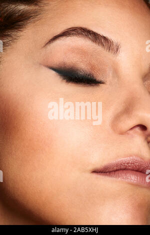 Close up shot of a woman face with beauty make up. Stock Photo