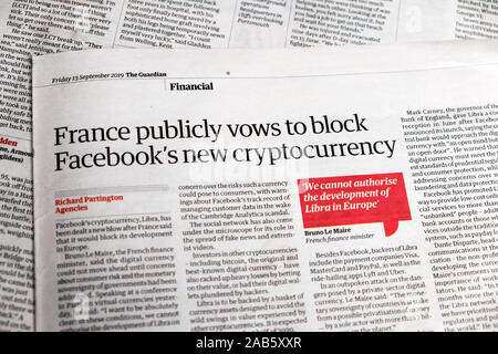 'France publicly vows to block Facebook's new cryptocurrency' Guardian newspaper headline inside page 13 September 2019 London England UK Stock Photo
