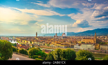 Florence or Firenze sunset aerial cityscape. Panorama view from Michelangelo park square. Ponte Vecchio bridge, Palazzo Vecchio and Duomo Cathedral. T
