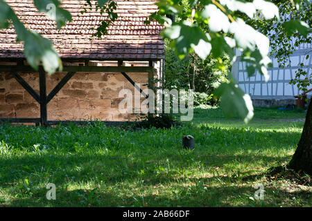 A Stone Shed With Timber Frame In An Idyllic Green Environment
