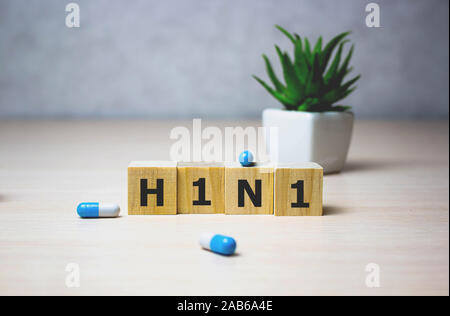 Swine flu H1N1 disease on wooden cubes, background. Selective focus. Medical concept. Stock Photo