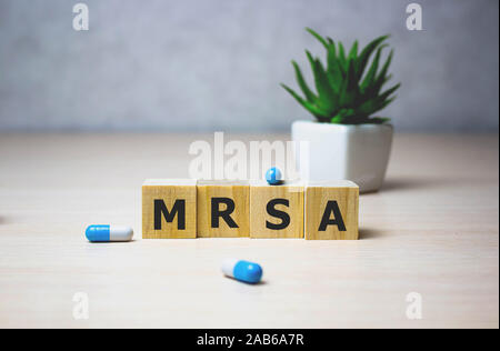 wodden cubes with words MRSA Methicillin-resistant Staphylococcus Aureus. Medical concept Stock Photo