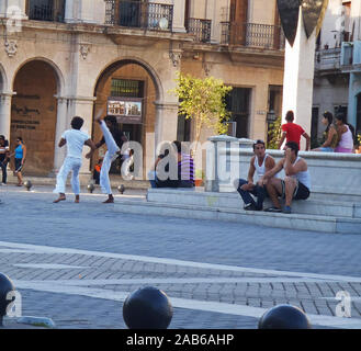 Havana, Cuba - April 24, 2012: A group of young people performs Brasilian Capoeira in the street of the cuban capital city; the public enjoys the free Stock Photo