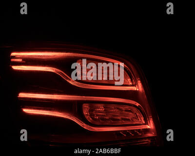 LED car backlight with red stripes in the dark Stock Photo