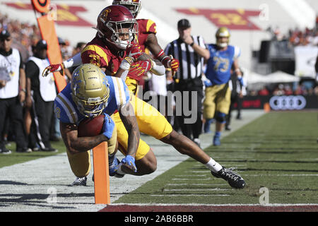 Los Angeles, CA, USA. 23rd Nov, 2019. November 23, 2019: UCLA Bruins running back Kazmeir Allen (19) comes up just short of the end zone as he is pushed out of bounds by USC Trojans safety Isaiah Pola-Mao (21) during the game between the UCLA Bruins and the USC Trojans at The Los Angeles Memorial Coliseum in Los Angeles, CA. Credit: Peter Joneleit/ZUMA Wire/Alamy Live News Stock Photo
