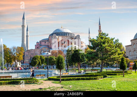 Tourists enjoy afternoon in Sultanahmet Square with the Hagia Sophia museum mosque in view in Istanbul, Turkey. Stock Photo
