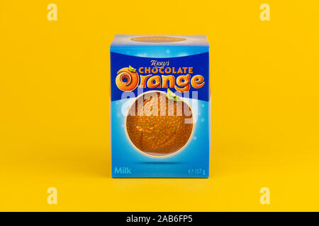 A Terry's Chocolate Orange shot on a yellow background. Stock Photo