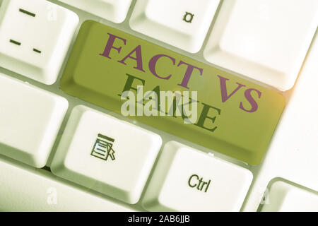 Text sign showing Fact Vs Fake. Business photo showcasing Rivalry or products or information originaly made or imitation Stock Photo