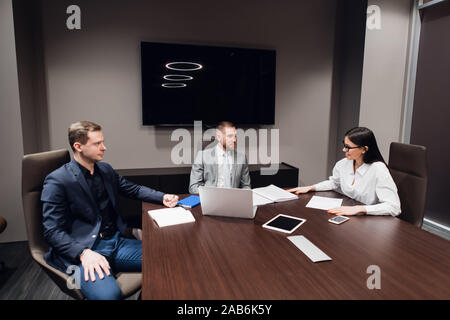Group of business people having a discussion in conference room Stock Photo